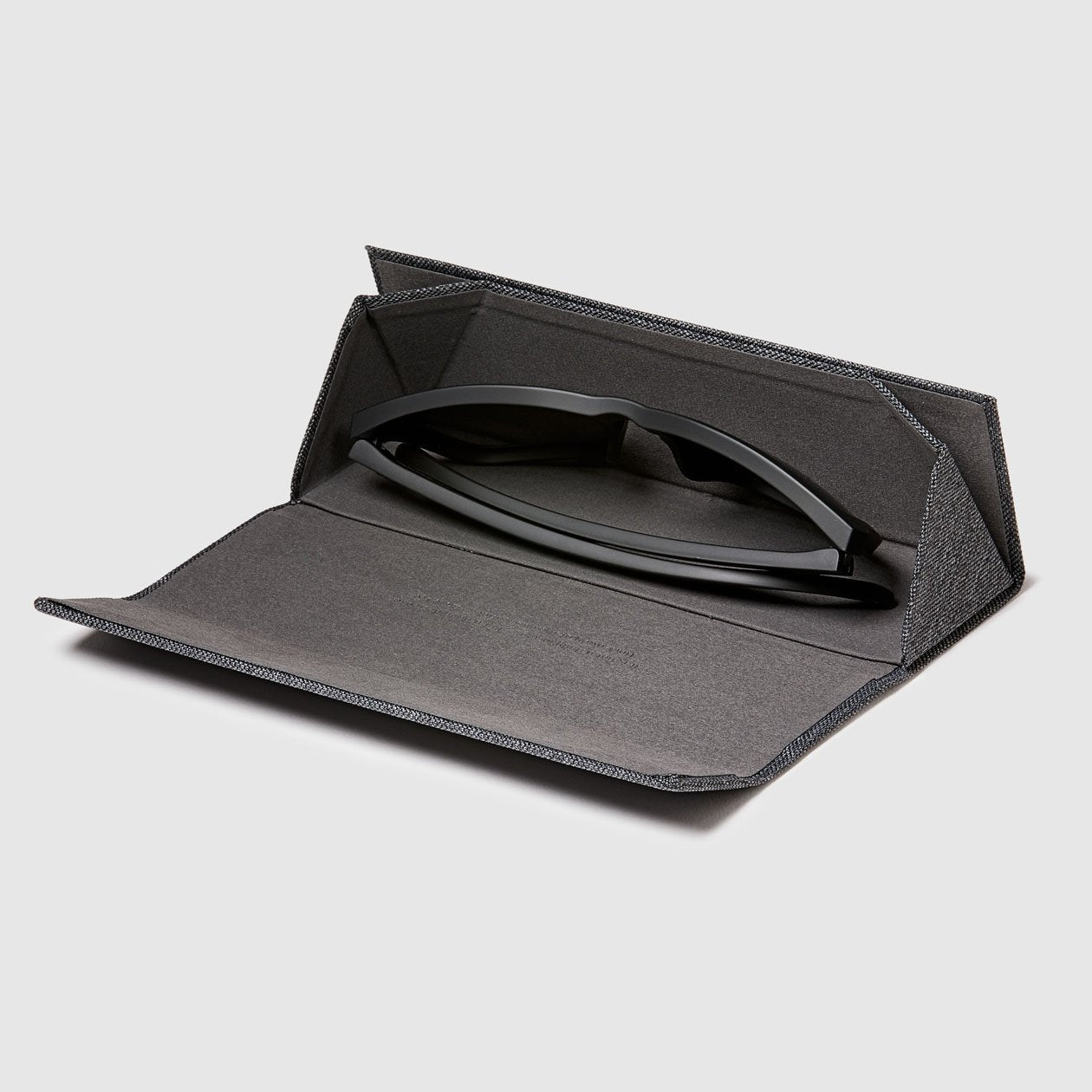 distil origami glasses hard case opened with maglock glasses inside on a white backdrop