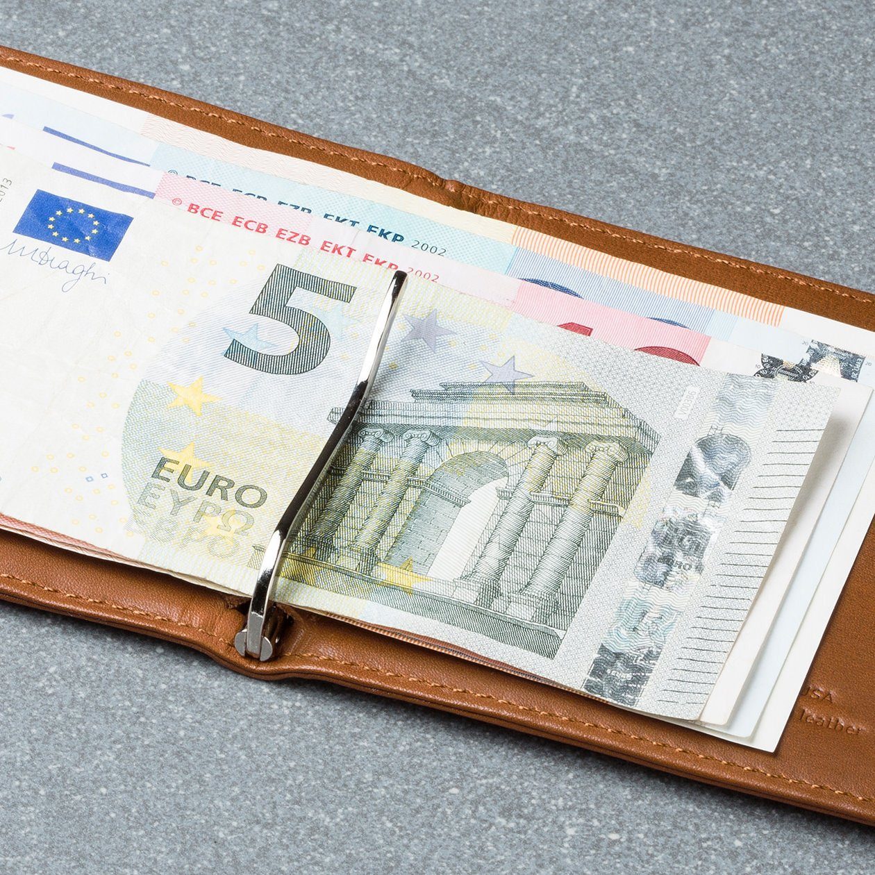 euro bills attached to a money clip in the hickory leather wally euro travel wallet
