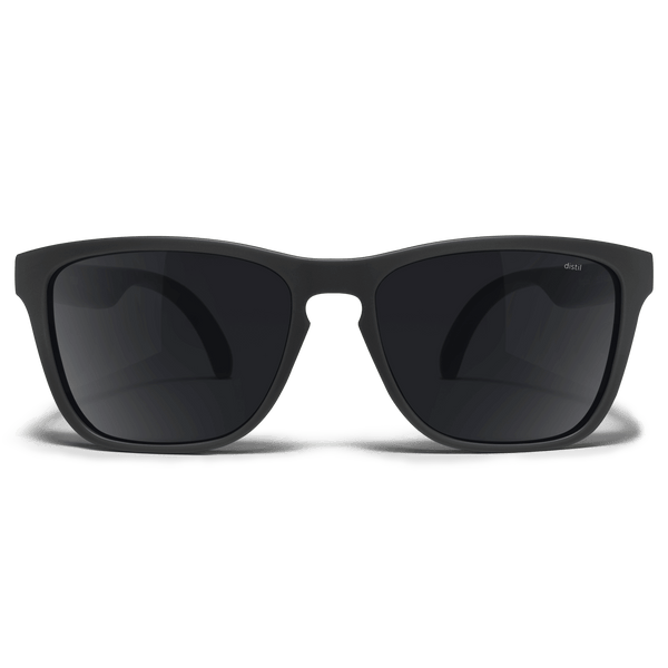 Distil Union Folly MagLock sunglasses in a black wayfarer design and polarized lens on a white backdrop