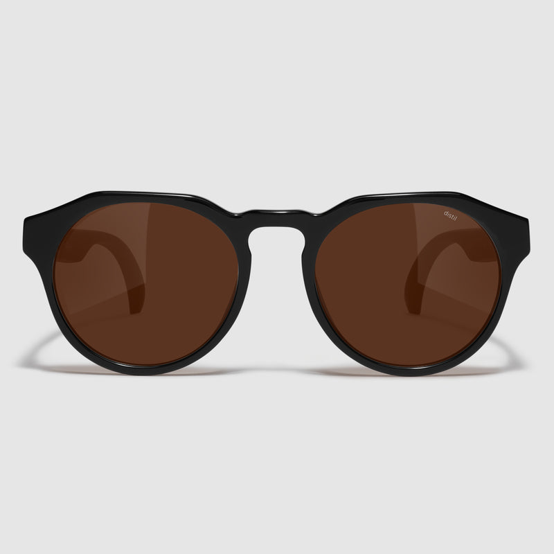 front view of distil cooper sunglasses with black frames and amber polarized lens