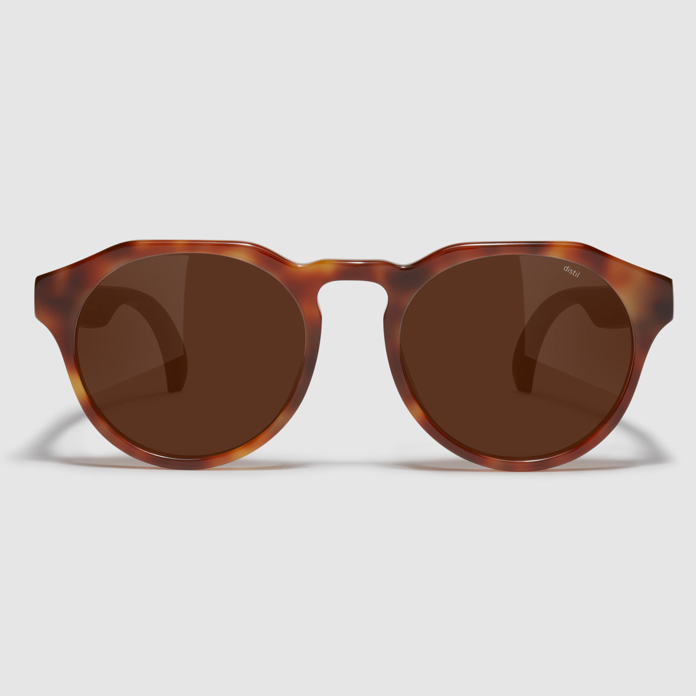 front view of distil cooper sunglasses with tortoise frames and amber polarized lens