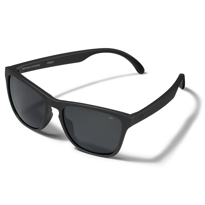 Distil Union Folly MagLock sunglasses in a black wayfarer design and polarized lens on a white backdrop