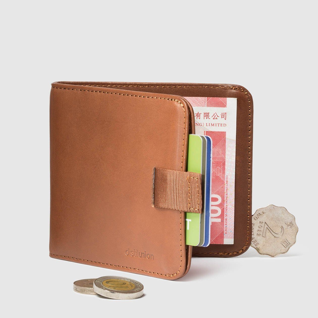 coins around distil hickory leather bifold travel wallet half open with pull-tab