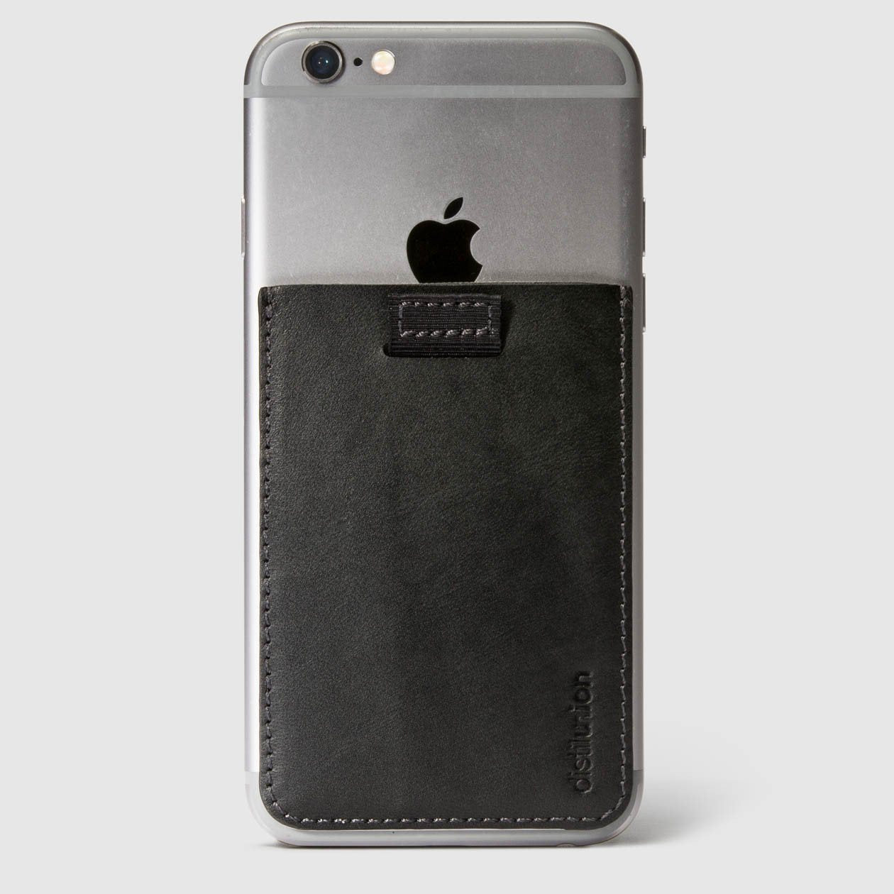 distil black leather wally junior stick-on on the back of an iphone with a pull-tab
