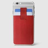 red leather wally junior stick-on attached to iphone with a pull-tab withdrawing cards